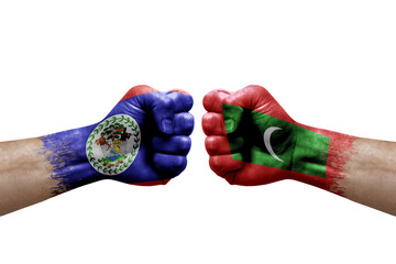 Two hands punch to each others on white background. Country flags painted fists, conflict crisis concept between belize and maldives