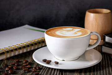 Cappuccino cup, Cappuccino coffee in a beautiful glass on the table favorite cup of coffee concept.
