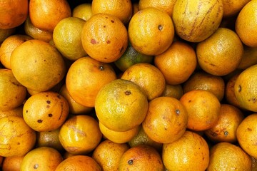 A group of juicy oranges for sale in the market