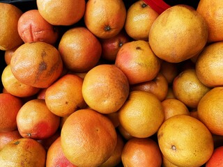A group of grapefruits for sale in the market