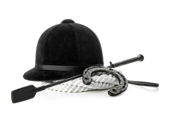 Horse riding helmet and crop with rope and horseshoe on white background