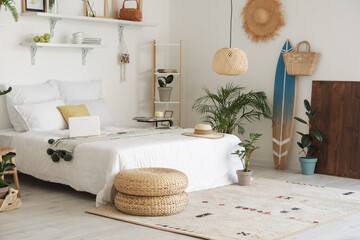 Stylish interior of modern bedroom with houseplants