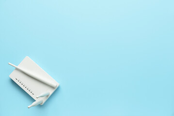 White wi-fi router on color background