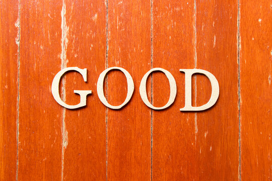 Alphabet letter in word good on old red color wood plate background