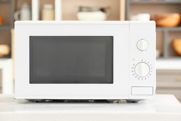 Microwave oven on counter in modern kitchen, closeup