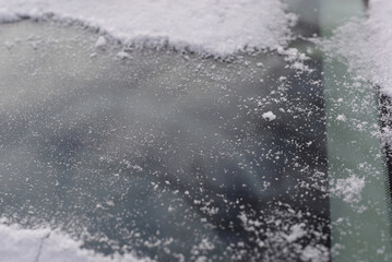 snow covered window glass on vehicle 