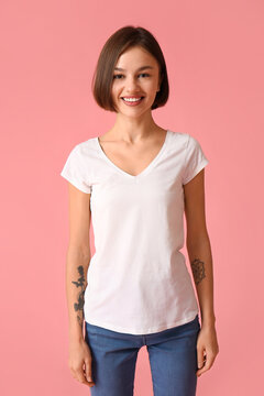 Beautiful young woman in stylish t-shirt on color background