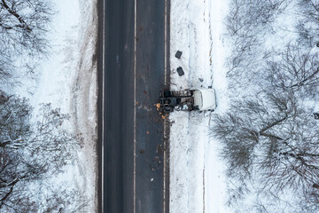 Truck accident, aerial view in winter, road icing in winter, drone view