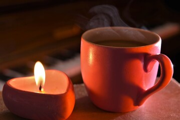 cup of coffee with candle