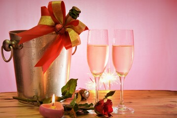 two glasses of champagne and gift