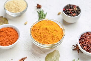 Composition with bowls of different spices on light background, closeup