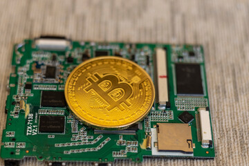 Bitcoin crypto currency coin on a circuit board mining concept