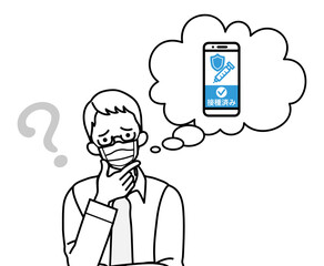 ワクチン接種証明のスマホアプリに疑問を持つマスクを着用したシニア男性