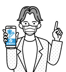ワクチン接種証明の画面を表示したスマホを持ち、指を差す若い男性 - マスク着用