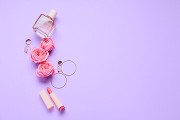 Perfume, lipstick, accessories and flowers for International Women's Day celebration on purple background
