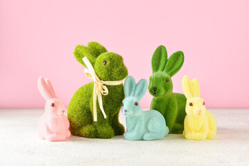 Different Easter bunnies on color background