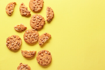 Tasty peanut cookies on yellow background