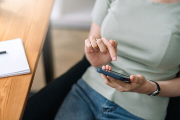 Woman using mobile phone to send text , work or play social media.