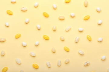Fototapeta na wymiar Different jelly beans on beige background