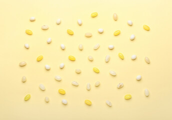 Different jelly beans on beige background
