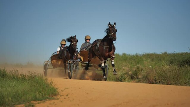 Slow mo of harness horses training