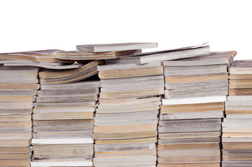 Stacks of old books placed separately on a white background.