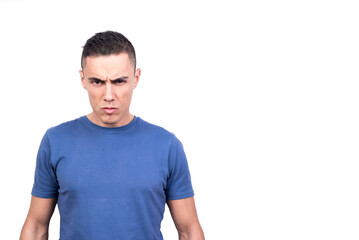 Fototapeta premium Man standing looking at camera with serious and confrontational expression