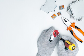 Electrician repairing electrical plug on the desk. Top view with copy space.