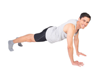 Positive sportsman doing push ups in studio