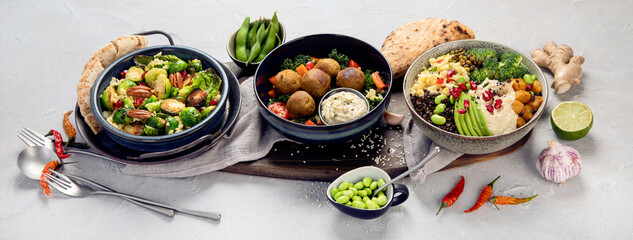 Vegan dishes assortment on light background.
