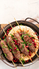 Kebab with pita on light background.