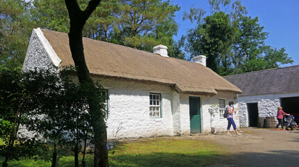 Old Irish Traditional Whitewashed Cottage with a thatched roof at The Ulster America Folk Park Northern Ireland © Peter Steele