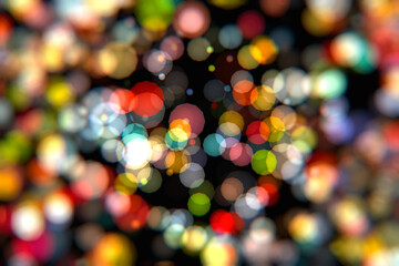 Multi-colored round bokeh on a black background.