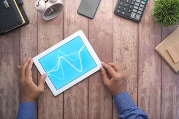 Fototapeta na wymiar analyzing stock market data on digital tablet