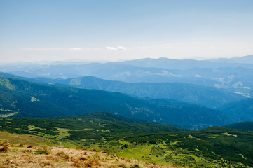 Fototapeta premium bird's eye view of the mountains, morning blue fog. High quality photo