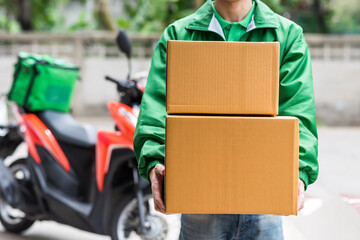 deliverman with uniform give parcel by motorbike