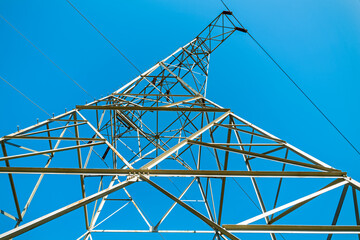 A view of the top of a high voltage transmission tower from below