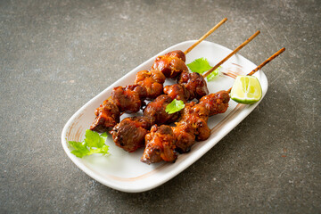 grilled chicken gizzard skewer with herbs and spices