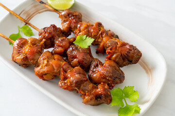 grilled chicken gizzard skewer with herbs and spices