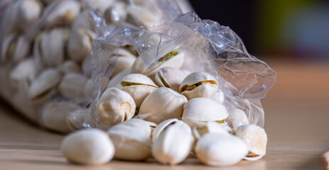 Closeup Nut in hard shell in plastic bag on table