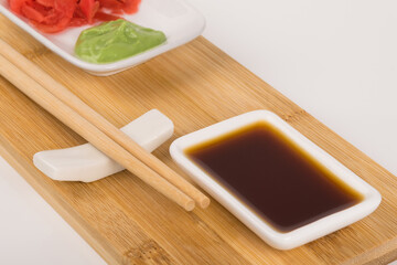 sushi food set with soy sauce and spices, front view