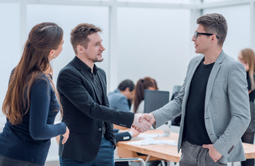 business people meeting each other with a handshake.