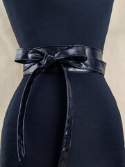 Belt on the woman's waist. The image and the option of tying