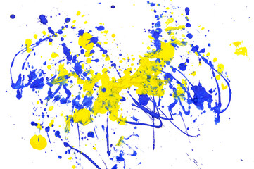 Drops of yellow and blue paint on a white paper background.