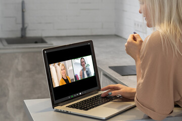 Woman talk speak using laptop computer working and video conference online meeting with colleagues...