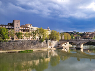 Fototapeta na wymiar Bridges in Rome Italy with storm clouds 