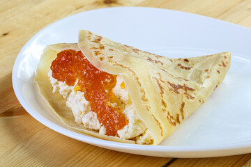 Pancake with cottage cheese and jam