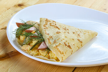 Pancake with potato and sausages