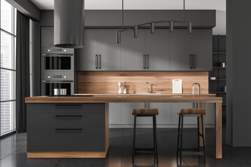 Black kitchen set interior with countertop and seats, kitchenware and window