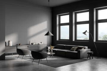 Living room interior with couch and armchair with commode near panoramic window